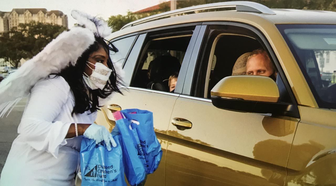 Volunteer “Angels” gave out more than 500 goodie bags provided by Disabled Children’s Fund at the Joint Base San Antonio 2020 "Howl Down" - a safe Halloween event designed with disabled children in mind, and included a COVID-safe drive-by format.
